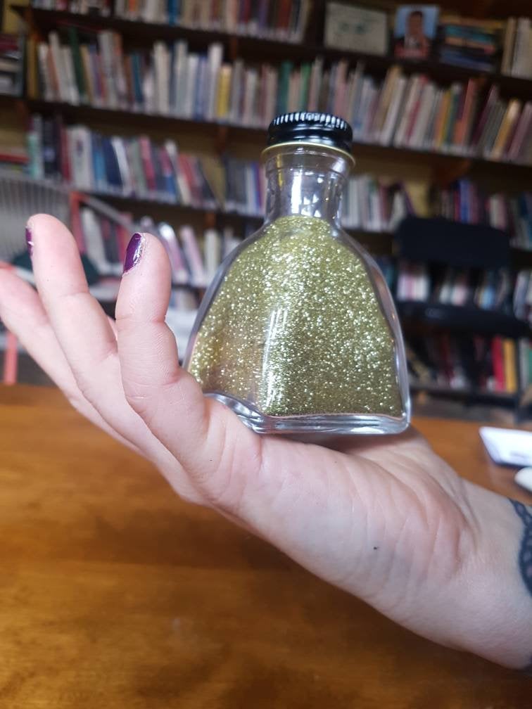 Eco-friendly glitter in glass bottle for burlesque pours, photoshoots, wedding toss, soap making, and bulk sparkles